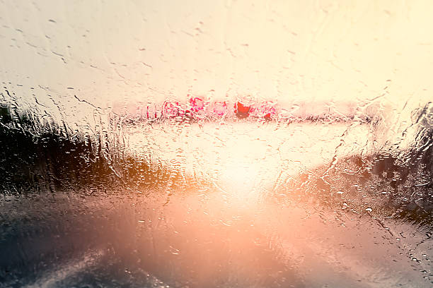 Bad Weather Driving Bad Weather Driving - poor view caused by heavy rain and back light truck in rain stock pictures, royalty-free photos & images
