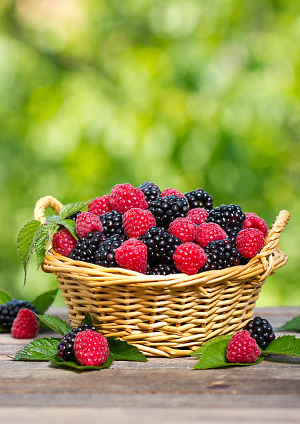 istock Raspberry and blackberry in the basket 477908633