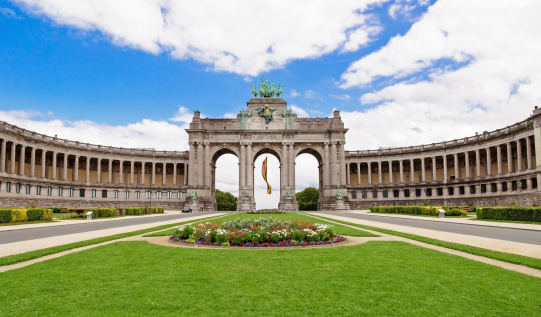 The Triumphal Arch in Cinquantenaire Parc in Brussels, Belgium with flowers in summer