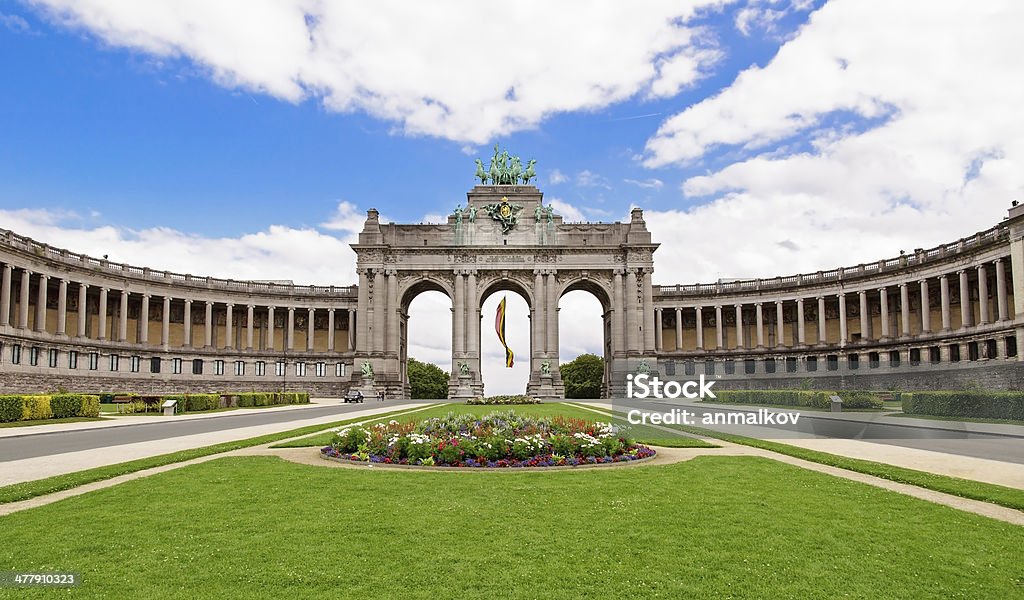 The Triumphal Arch in Cinquantenaire Parc in Brussels, Belgium w The Triumphal Arch in Cinquantenaire Parc in Brussels, Belgium with flowers in summer Brussels-Capital Region Stock Photo