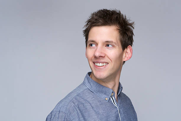 istock Portrait of a smiling man looking away 477911025