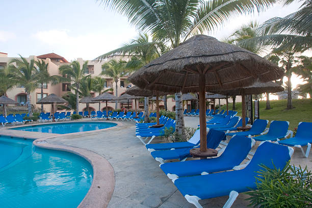 istock Beautiful pool and patio in tropical setting 477913149
