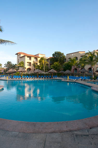 istock Beautiful pool and patio in tropical setting 477913153