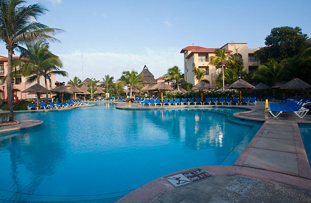 istock Beautiful pool and patio in tropical setting 477913159