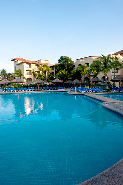 istock Beautiful pool and patio in tropical setting 477913319
