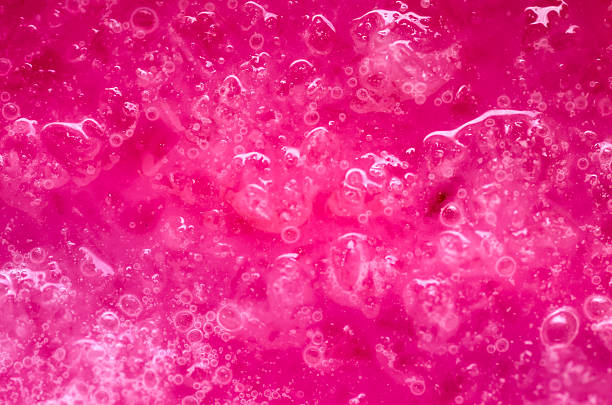 Surface of stawbery shake Bubbles and ice fragments floating on surface of strawberry shake. slimy stock pictures, royalty-free photos & images