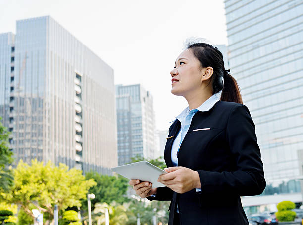 istock Asian businesswoman using digital tablet 477913886