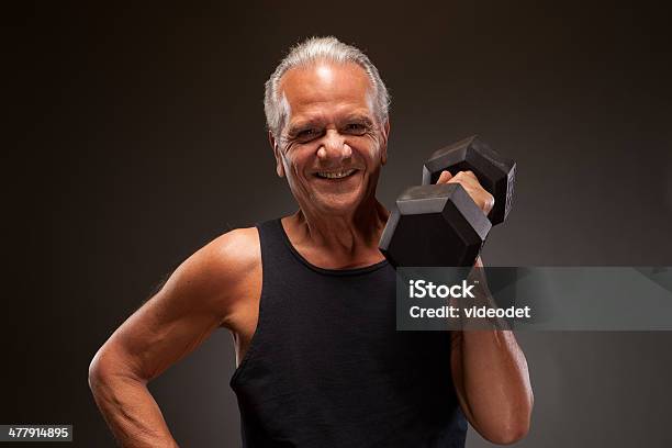 Portrait Of A Senior Man Lifting Dumbbell Stock Photo - Download Image Now - Active Seniors, Adult, Adults Only
