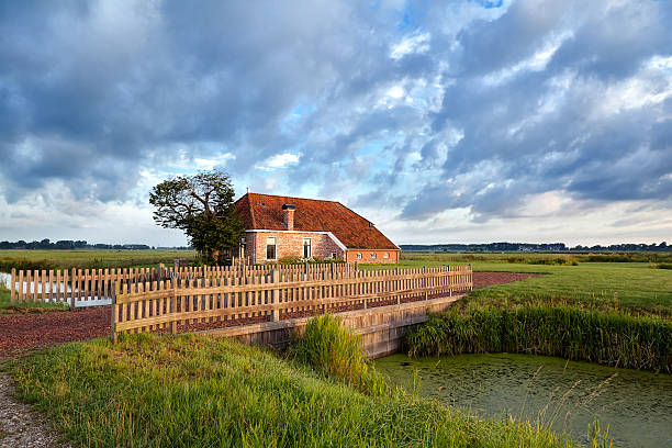 istock charming farmhouse and blue sky 477914983