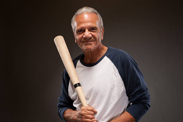 istock senior man with a baseball bat 477917795
