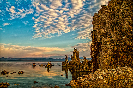 Tufa is a variety of limestone, formed by the precipitation of carbonate minerals from ambient temperature water bodies. Geothermally heated hot springs sometimes produce similar (but less porous) carbonate deposits known as travertine. Tufa is sometimes referred to as (meteogene) travertine;