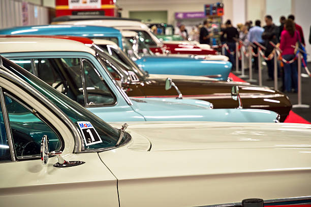 Beylikduzu, Istanbul , Turkey - November 05 , 2012: Old Fashioned Car on display during the Istanbul Autoshow 2012. People in the background are looking at the cars.