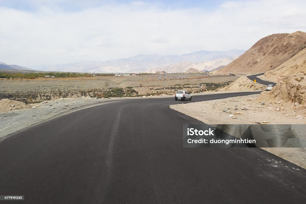 Landscape view on the road of Leh Ladakh, Northern India. Ladakh ("land of high passes"). a region of India in the state of Jammu and Kashmir that currently extends from the Kuen Lun mountain range  to the main Great Himalayas to the south, inhabited by people of Indo-Aryan and Tibetan descent. 2015 Stock Photo