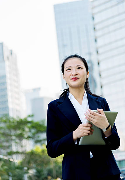 istock Asian businesswoman using digital tablet 477919812