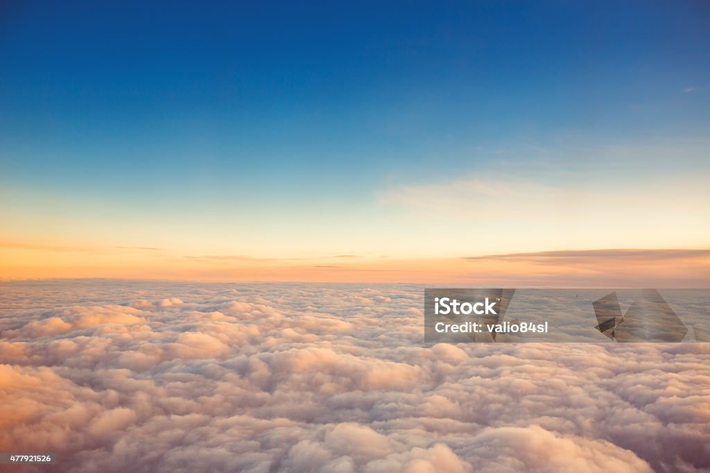 Flying above the clouds. view from the airplane Cloud - Sky Stock Photo