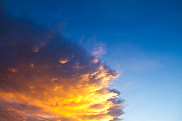 istock orange and yellow colors sunset on blue sky 477923301