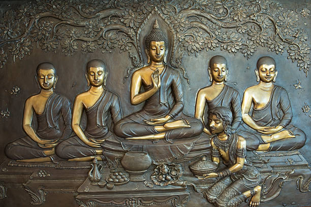 istock Buddha life scenes on carved metal 477923969