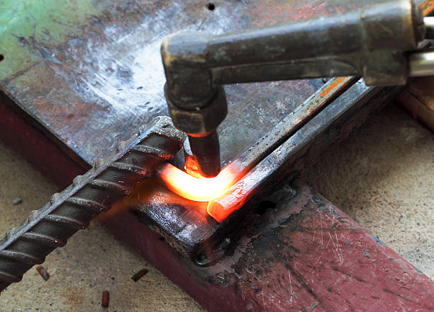 istock Gas heating cutting metal bending square bar 477924413