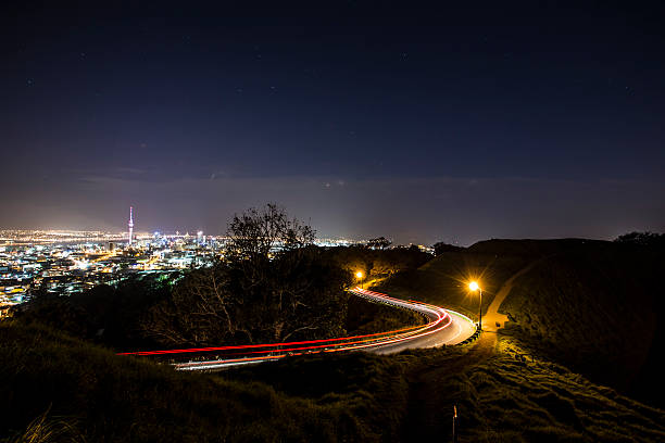 Auckland city skyline by night with light trails