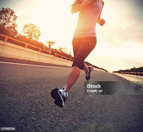 Young Woman Runner Running On City Bridge Road Stock Photo - Download Image Now - Sunrise - Dawn, 2015, Activity