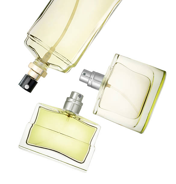 perfume frascos flotante - perfume sprayer fotografías e imágenes de stock
