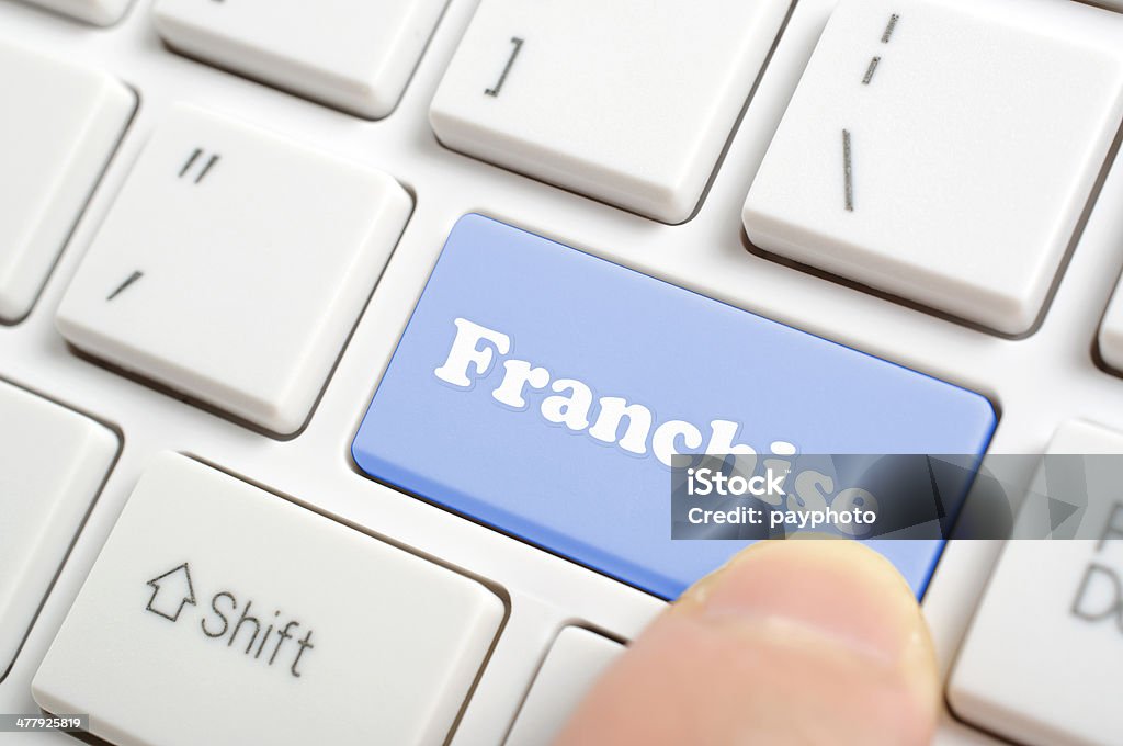 Pressing franchise key on keyboard Business Stock Photo