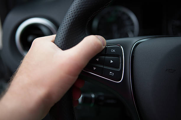 istock hand of man driving a car 477926358