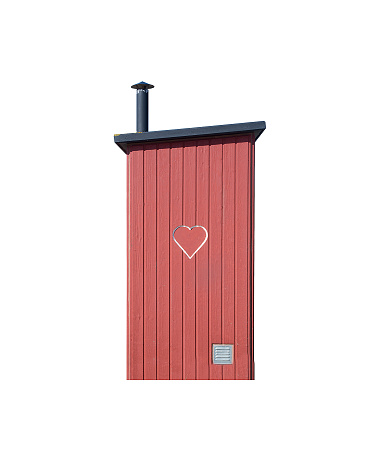 Small privy toilet house in red wood with heart and air ventilation isolated on white.