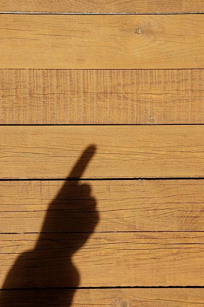 istock Shadow of a hand with a index finger 477931209