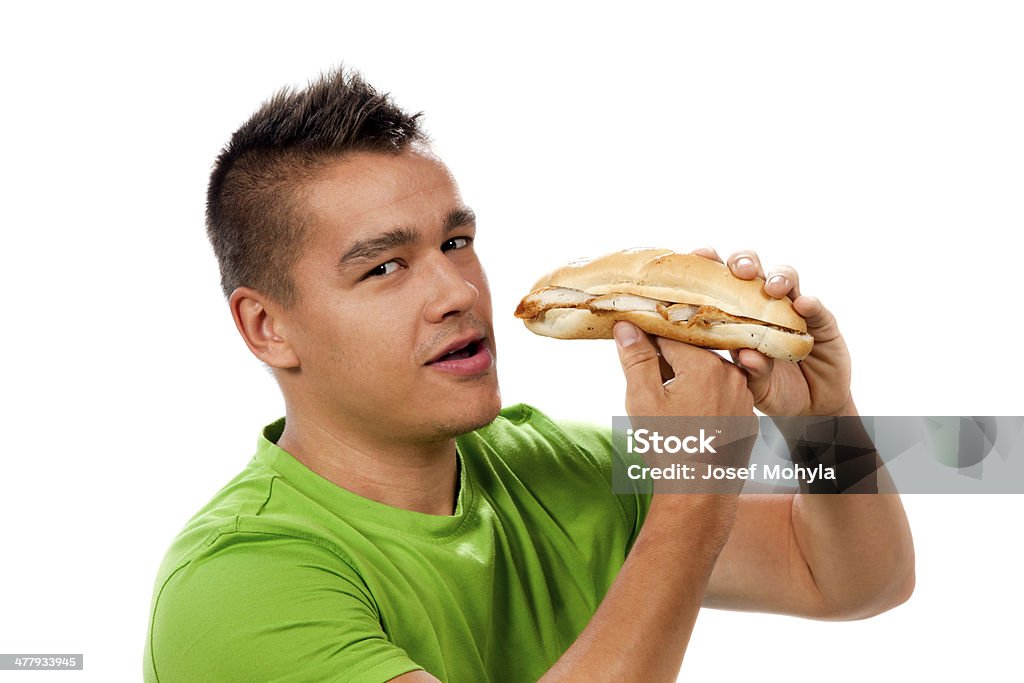 Joven mujer comiendo sándwich - Foto de stock de Hombres libre de derechos
