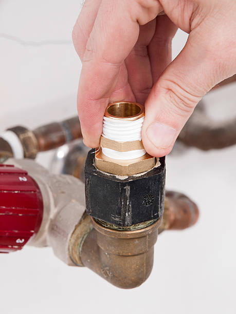istock Hand repairing a plumbing pipes 477935137