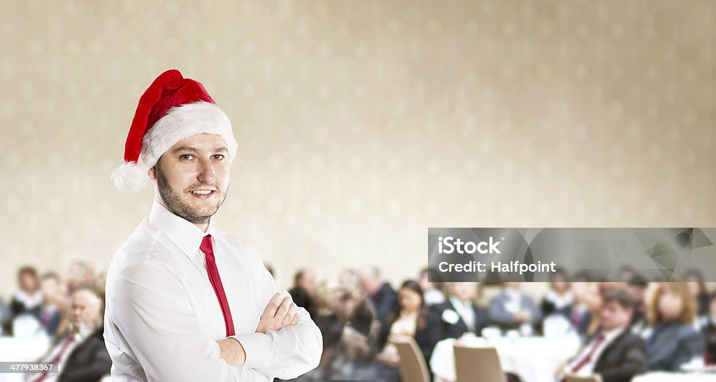 Christmas conference Funny businessman with christmas cap is on conference Adult Stock Photo