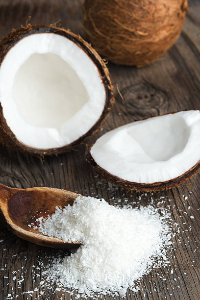 istock Coconut and coconut flakes on wood 477938898