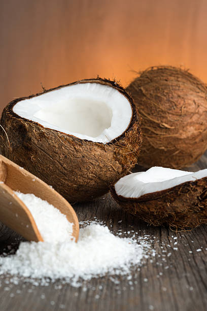 istock Coconut and coconut flakes on wood 477939702