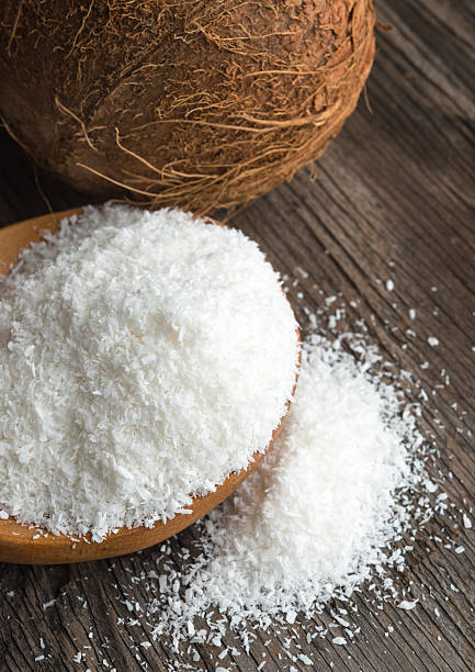 istock Coconut and coconut flakes on wood 477939706