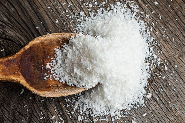 istock Coconut flour on wood, close up 477939722