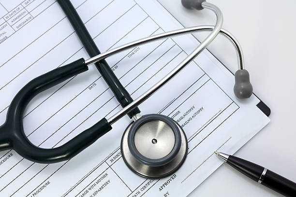 istock pen and stethoscope on blank Patient information 477939983