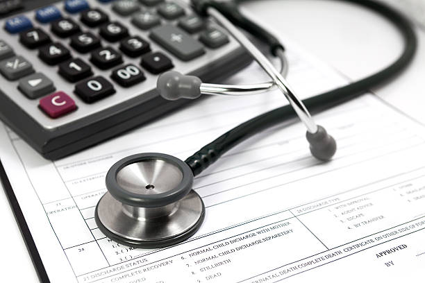 istock calculator and stethoscope on blank Patient information 477940003