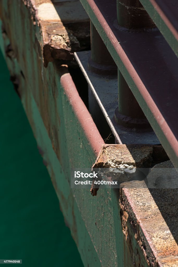 Crumbling infrastructure The edge of a crumbling walkway on a Chicago loop bridge. 2015 Stock Photo