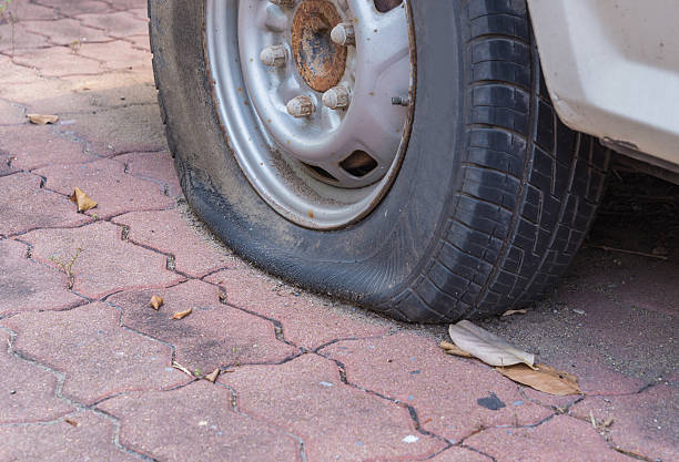 istock Deflated damaged tyre on car wheel 477940618