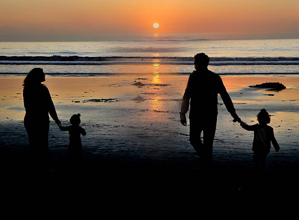 istock Family taking a stroll at sunset west coast USA 477940768