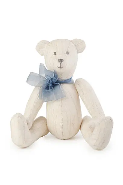 Toy handmade teddy bear on white