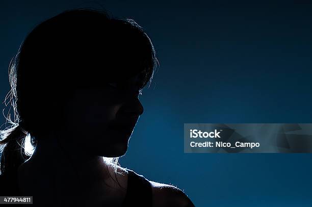Silhouette On Blue Background Stock Photo - Download Image Now - Women, Shade, Dark Blue