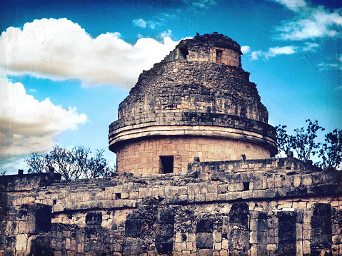 Mayan Observatory in Chichen-Itza, Mexico.  Mayan pyramids complex Chichen-Itza in Merida district is famous landmark of peninsula Yucatan. One of New7Wonders of the World. UNECSO World Heritage Sites. . Retro style
