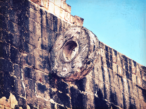 The Ballgame ring in Mayan pyramids complex Chichen-Itza in Merida district, Mexico. Famous landmark of peninsula Yucatan. One of New7Wonders of the World. UNECSO World Heritage Sites. Retro style.