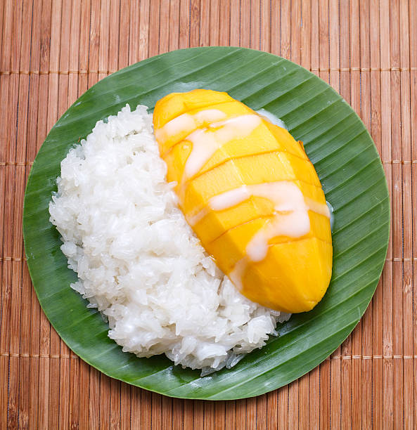 istock dessert sweet sticky rice with mango coconut milk 477950279