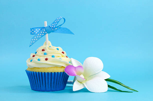 istock Beautiful blue cupcake with orchid flower 477952211