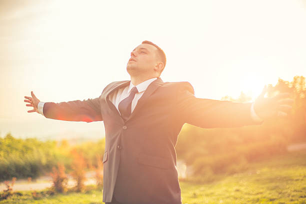 istock Businessman in spring field 477952756