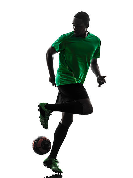 istock african man soccer player silhouette 477958879