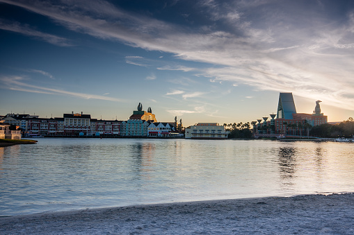 Orlando, FL, USA - January 15, 2012: Boardwalk Disney  area with Swan and Dolphin hotel on Crescent Lake shore at sunset in Orlando on January 15, 2012.
